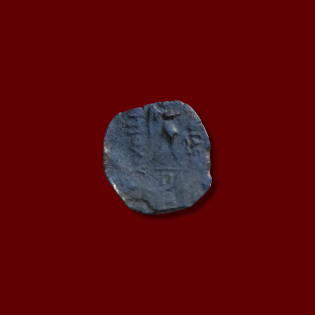 Ancient coin reverse showing Greek inscription with faint figure or elephant representation, issued by Antiochus I.