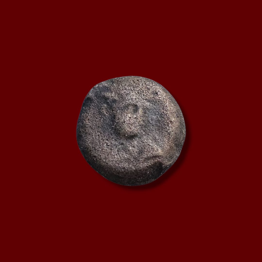 Obverse showing a faint bust of Antiochus VII Sidetes, wearing diadem, facing right on an ancient bronze coin.